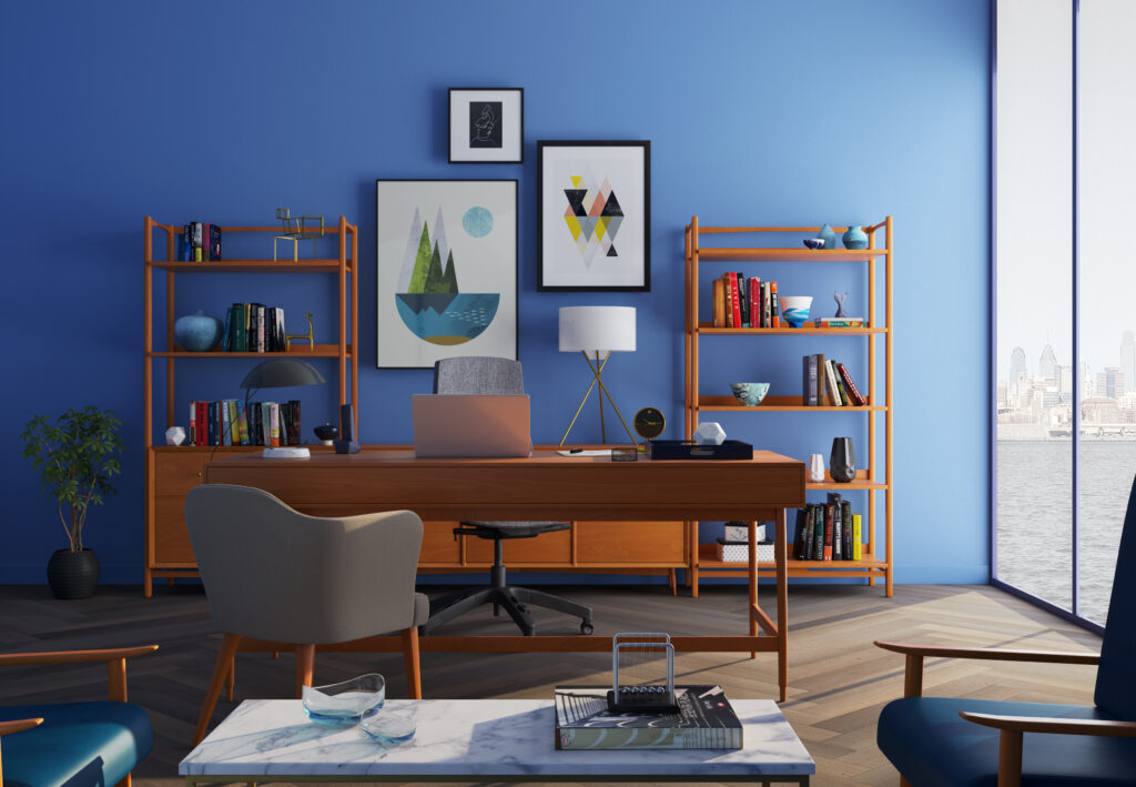 Brown wooden desk with rolling chair and shelves near window